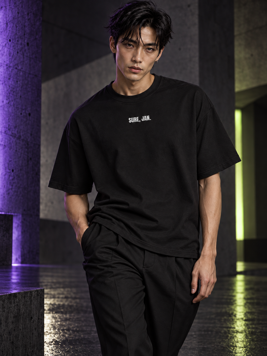 WRYKIND editorial — Magazine-style AI styling image of a male model posing in the SURE, JAN. black tee