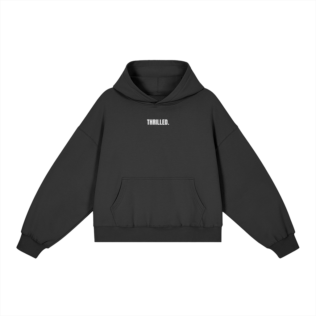 THRILLED. black boxy hoodie with compact white lettering centered on the upper chest